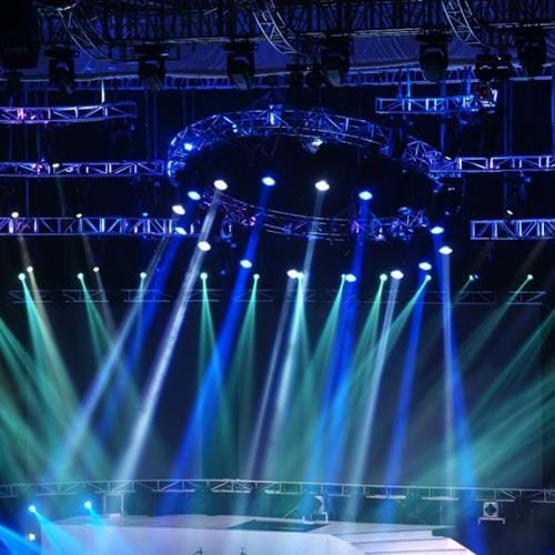 Empty stage lit up by many lights