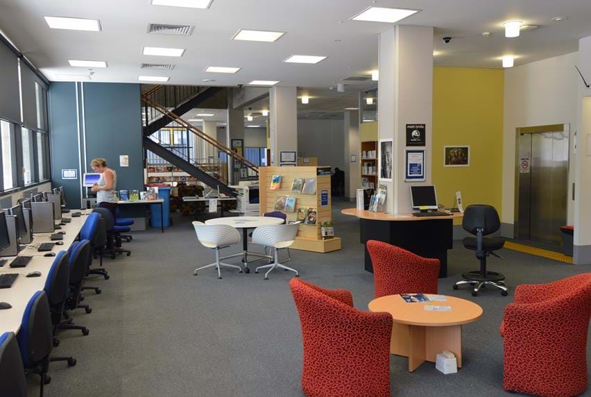 Work stations and meeting tables inside Melbourne Polytechnic's Prahan library