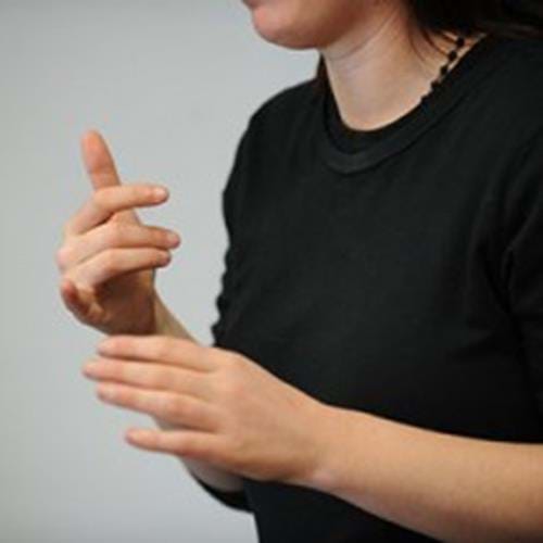 Woman signing in sign language 