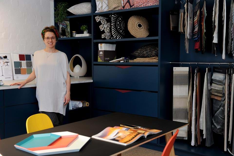Woman standing in designed office interior